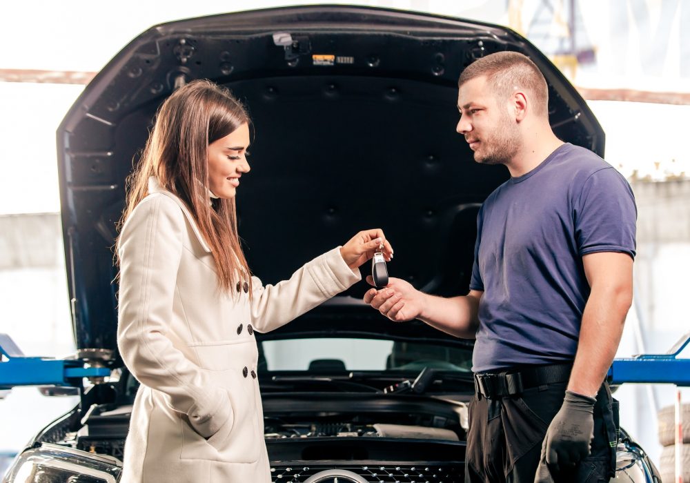 Customer giving keys to mechanic