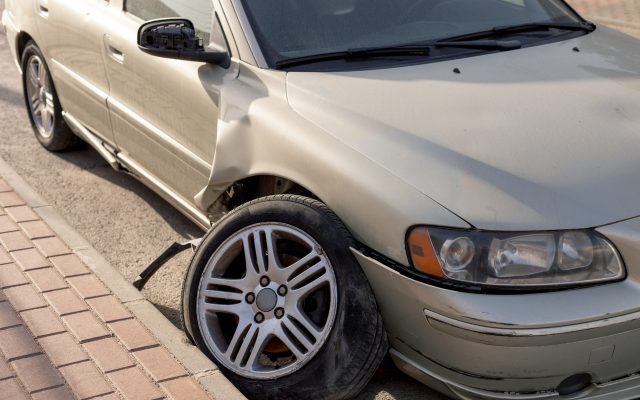 Severe damage to grey car’s side after a collision, showcasing a crumpled door and detached bumper. Ideal for use in insurance claims, automotive repair tutorials, and road safety awareness materials. Severe damage to grey car's side after a collision, showcasing a crumpled door and detached bumper. Ideal for use in insurance claims, automotive repair tutorials, and road safety awareness materials